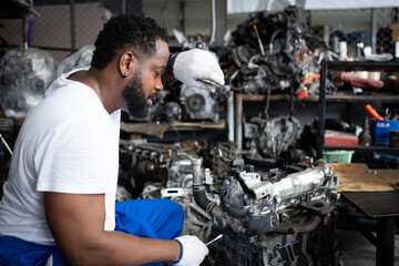 Men repairing car engine in auto repair shop, Selective focus.