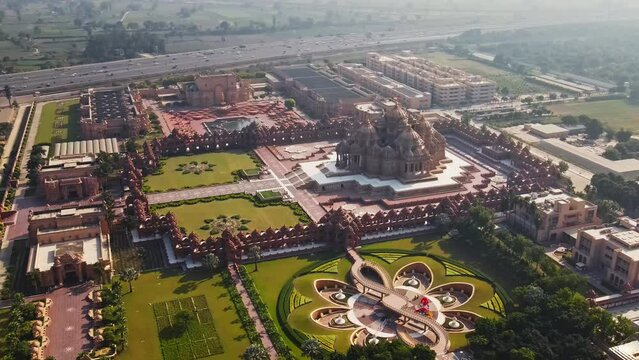 Aerial shot of Akshardham Temple in New Delhi, India. Drone view of a Hindu temple in India. Akshardham Complex is a Hindu temple, and a spiritual-cultural campus in Delhi, India.