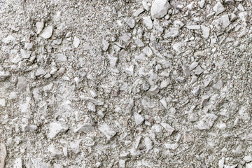 Crushed stone embedded in cement mortar, rough surface, background