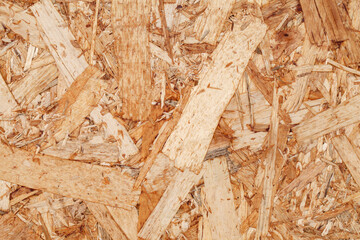 Chipboard plywood, surface close-up, uniform texture background, glued wood flat chips