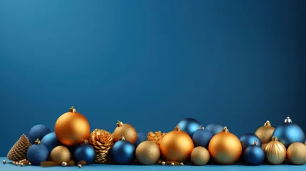 Fotobehang Row of color christmas balls hanging on strings over blue background © PaulShlykov