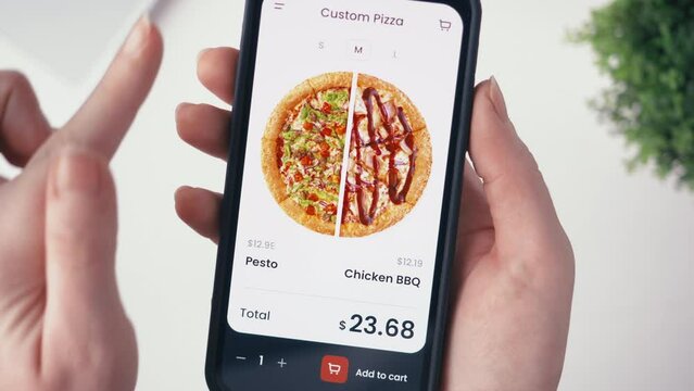 Customizing half-and-half pizza in an online delivery shop Making an online order in a fast food app. Fast food technology concept.