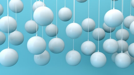 Row of color christmas balls hanging on strings over blue background