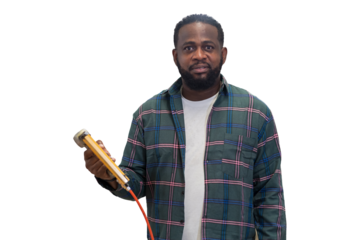 African American carpenter holding pneumatic nail gun on white background
