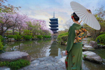 Young Japanese woman in traditional Kimono dress at Toji Temple in Kyoto, Japan with beautiful full...