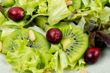 Healthy salad of kiwi and herbs.