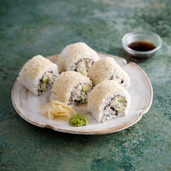 Homemade sushi rolls with crab meat and avocado