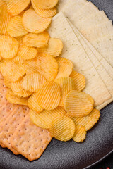 Crispy potato chips with salt, spices and herbs