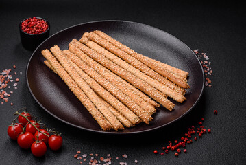 Delicious fresh grissini sticks with salt and sesame seeds
