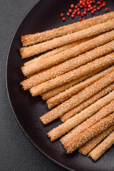 Delicious fresh grissini sticks with salt and sesame seeds