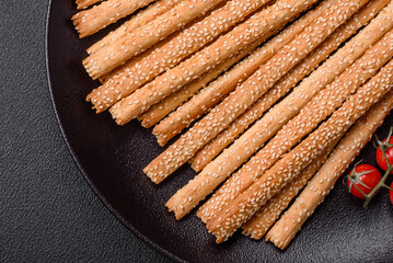 Delicious fresh grissini sticks with salt and sesame seeds