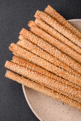 Delicious fresh grissini sticks with salt and sesame seeds