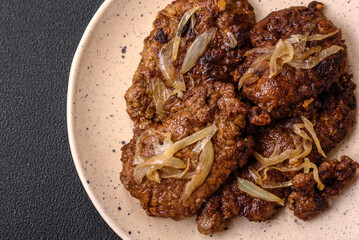 Delicious fried chicken or beef liver with salt, spices and herbs