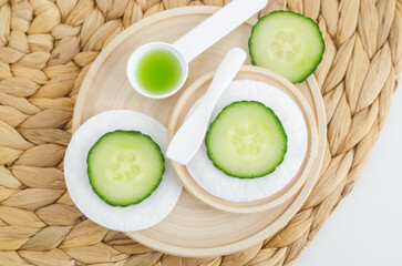 Cucumber slices for preparing homemade face toner or beauty mask. Natural beauty treatment and spa recipe. Top view.