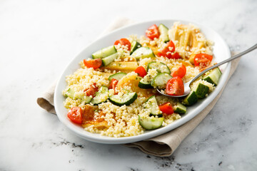 Couscous salad with grilled cheese and vegetables