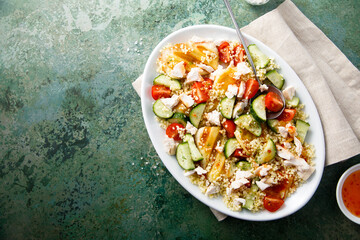 Couscous salad with grilled cheese and vegetables