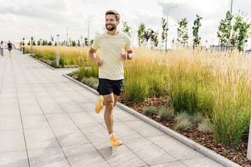 Trainer exercise jogging. A runner runs in fitness clothes. Confidence in every day and training.