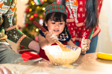 Little kid enjoy family celebrating xmas Christmas thanksgiving in dining room kneading cake dough happy together. People enjoy celebrate Christmastime holiday with yummy good taste food and drink.