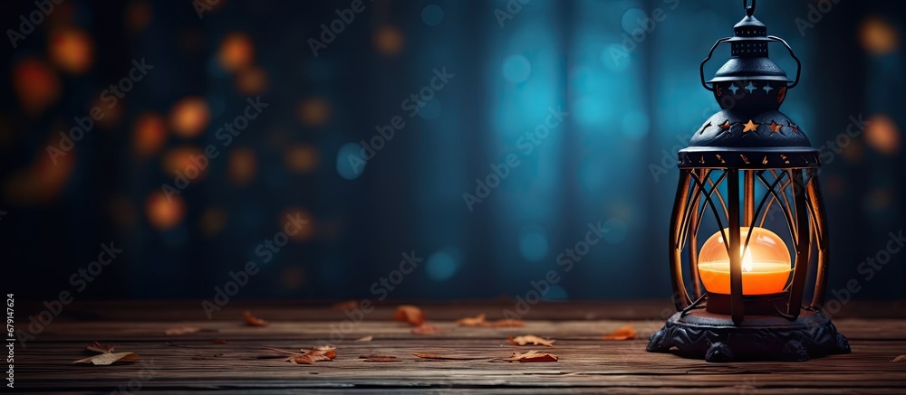 Poster lantern on old table in spooky halloween night copy space image place for adding text or design