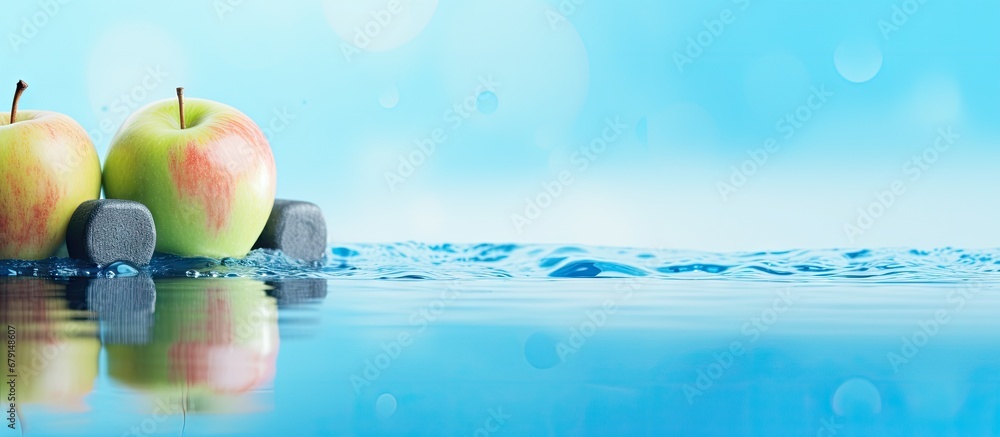 Poster fruit weights and liquid on pale blue backdrop copy space image place for adding text or design