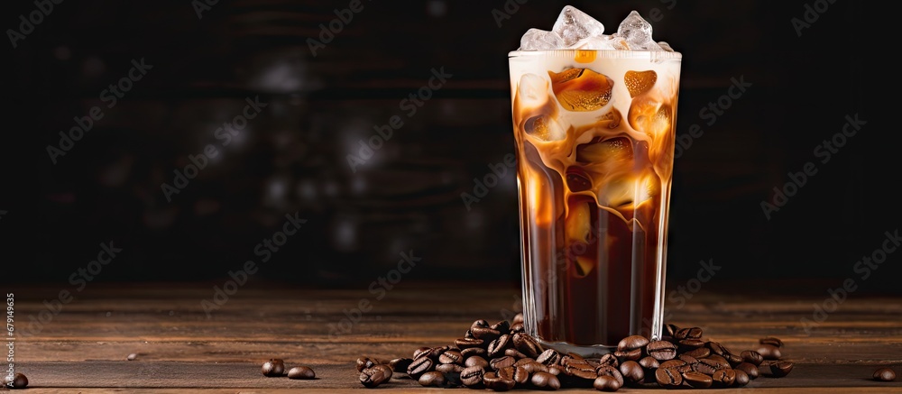 Canvas Prints Iced coffee with cream and beans on a rustic wooden table Cold drink on black background with space for text Copy space image Place for adding text or design