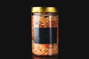 cabbage salad in a glass jar on black