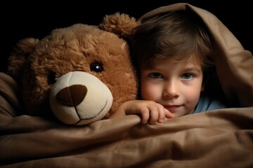 child with teddy bear in bed