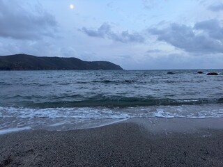 Biodola beach in winter with log