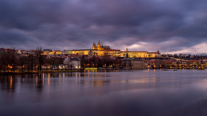 View of Prague Castle with Charles Bridge on a winter night