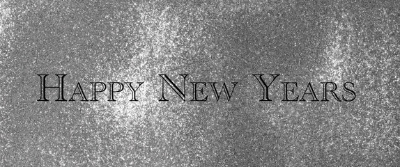 silver background with glitter and sparkles on the background inscription in black letters happy new year