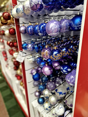 glassworks produce shiny scanned ornaments blown from glass by master glassblowers. fun and colored with cartoon motifs with glitter. children love swinging shelf in store, marketing, advertisement