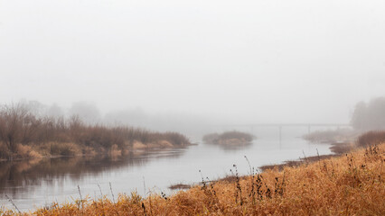 Autumn landscape. The river in the fog. Autumn landscape.