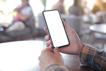 cell phone blank white screen mockup.hand holding texting using mobile on desk at office.background empty space for advertise.work people contact marketing business,technology