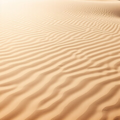 fotografia con detalle y textura de arena de tonos dorados con pequeñas ondulaciones propias de las dunas