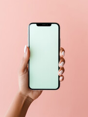 Woman's hand with beautiful white nails holding a smartphone on a pastel background. Ideal for...
