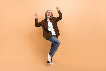 Full length body photo of attractive businesswoman dancer carefree party celebrate her last day working isolated on beige color background - obrazy, fototapety, plakaty
