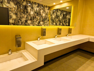 modern interior design in public toilet. bathroom sink for children. public bathroom