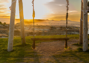 Beautiful Swings High in the Mountains Against the Backdrop of the Sunset. Suitable for Collages,...