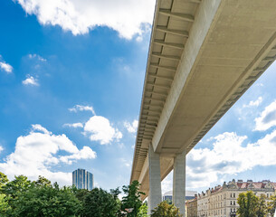 Naklejka premium Nusle bridge in Prague - hotel and blue cloudy sky