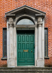 Green painted door in Ireland. Typical architecture