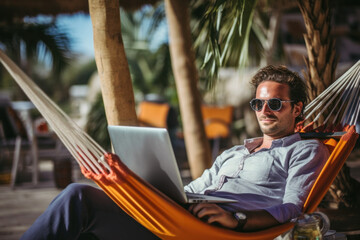 Man working on laptop while relaxing in hammock, remote worker enjoying the flexibility of remote work, digital nomad, work from vacation home concept