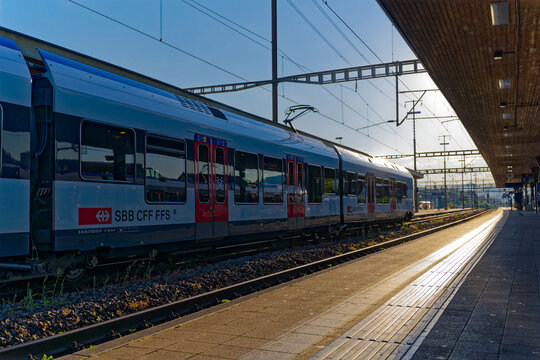 Platform at railway station at Swiss City of Lenzburg on a sunny late spring evening. Photo taken June 11th, 2023, Lenzburg, Canton Aargau, Switzerland.