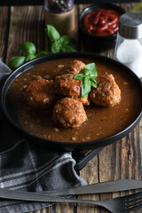 Meatballs with tomato sauce . on a wooden table. dinner