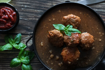 Meatballs with tomato sauce . on a wooden table. dinner