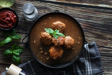 Meatballs with tomato sauce . on a wooden table. dinner