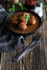 Meatballs with tomato sauce . on a wooden table. dinner