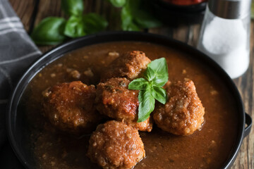 Meatballs with tomato sauce . on a wooden table. dinner