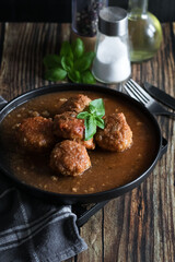 Meatballs with tomato sauce . on a wooden table. dinner