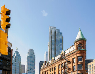 New and old architecture at Toronto Downtown. Gooderham Building, known Flatiron Building