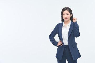 A young businesswoman in a suit is making various facial expressions and gestures.